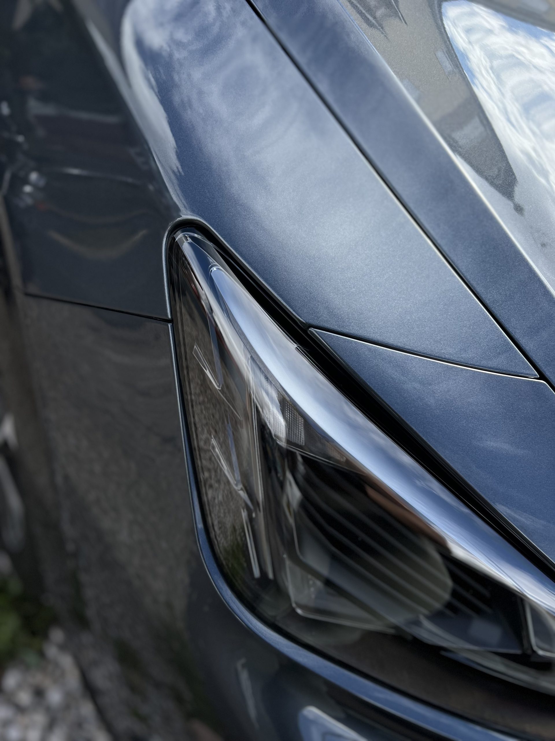 Detailed Cupra headlight and paint finish after professional vehicle care